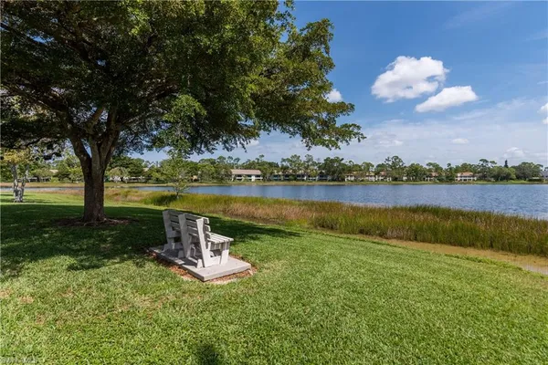 a view of a lake with a yard