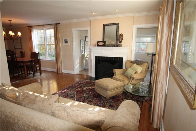 4328 Estes Road Nashville, TN 37215 - Photo 2 of 20 Lovely living room features hardwood floor, crown molding, original fireplace w/gas logs, custom silk drapes & plantation shutters.