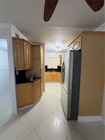 a kitchen with stainless steel appliances a refrigerator and a stove