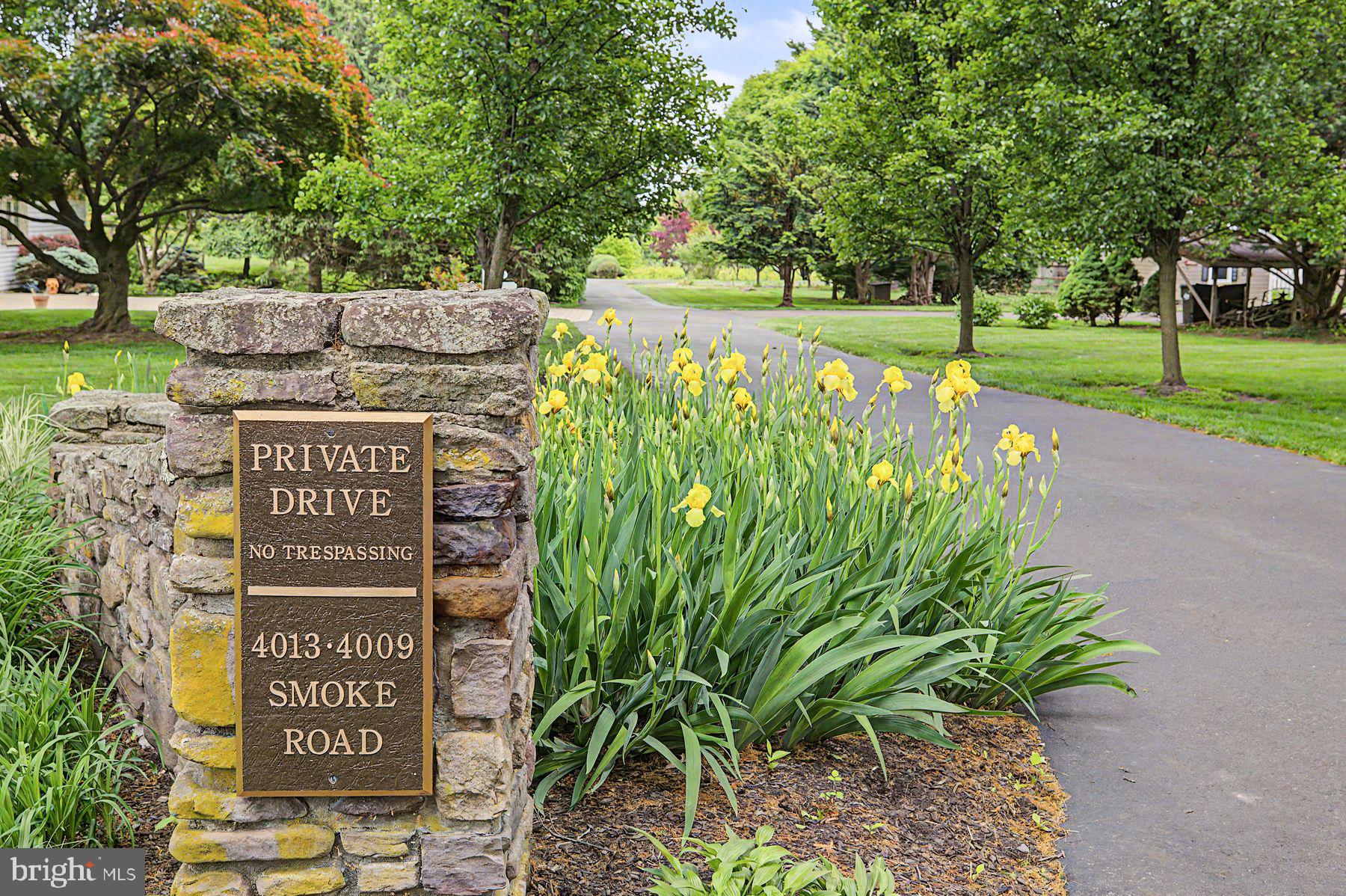 4009 Smoke Road Doylestown, PA 18902 - Photo 4 of 52 a view of a sign board with a park