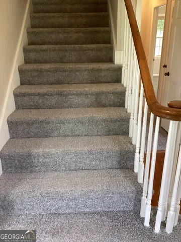 an empty room with large windows