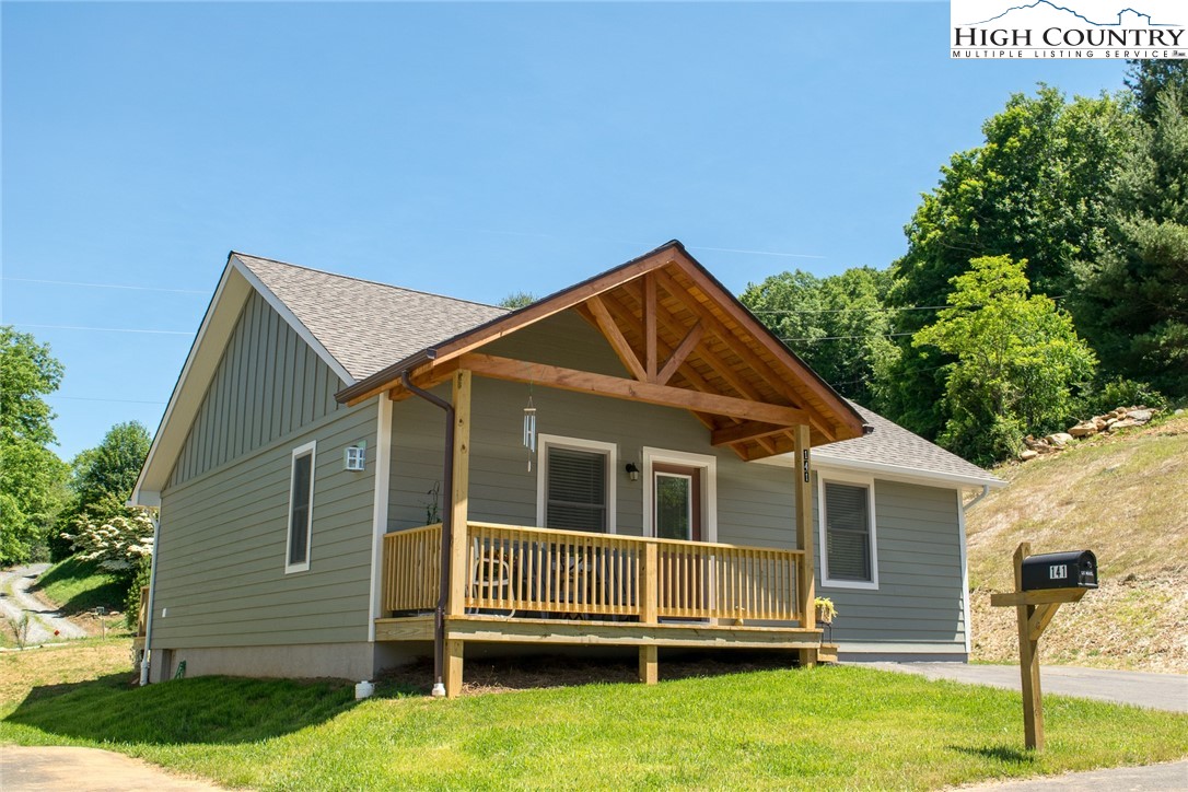 142 Casey Overlook Lane, Unit 82 Boone, NC 28607 - Photo 1 of 43 a front view of a house with a yard