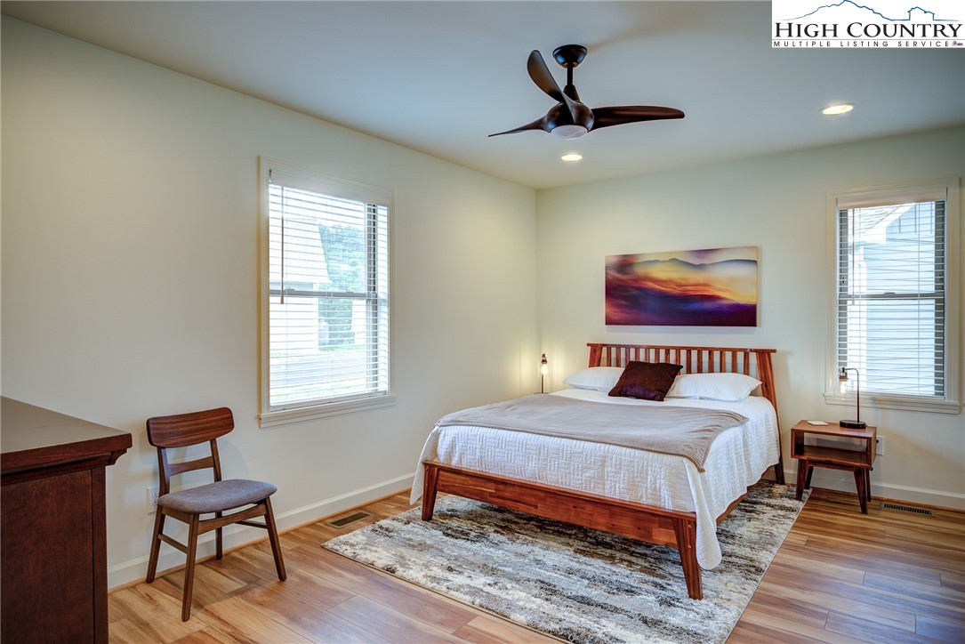 142 Casey Overlook Lane, Unit 82 Boone, NC 28607 - Photo 11 of 43 a bedroom with a bed and a window