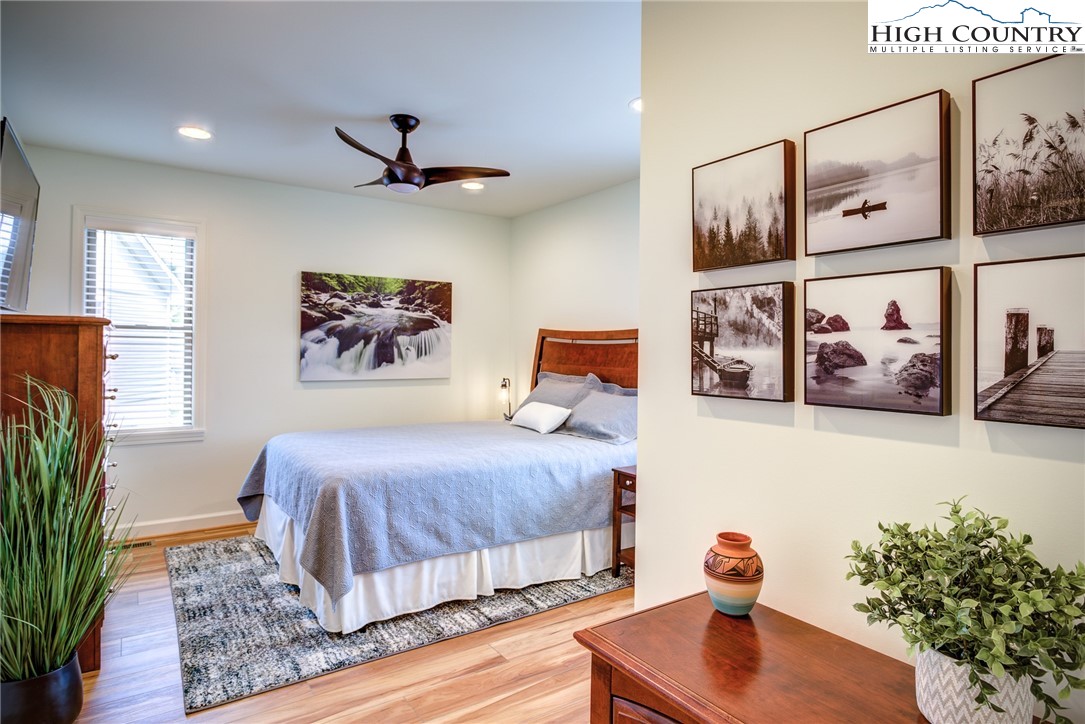 142 Casey Overlook Lane, Unit 82 Boone, NC 28607 - Photo 13 of 43 a bedroom with a bed and a couch