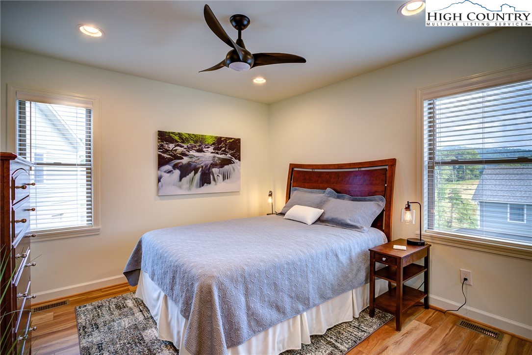 142 Casey Overlook Lane, Unit 82 Boone, NC 28607 - Photo 14 of 43 a bedroom with a large bed and a window