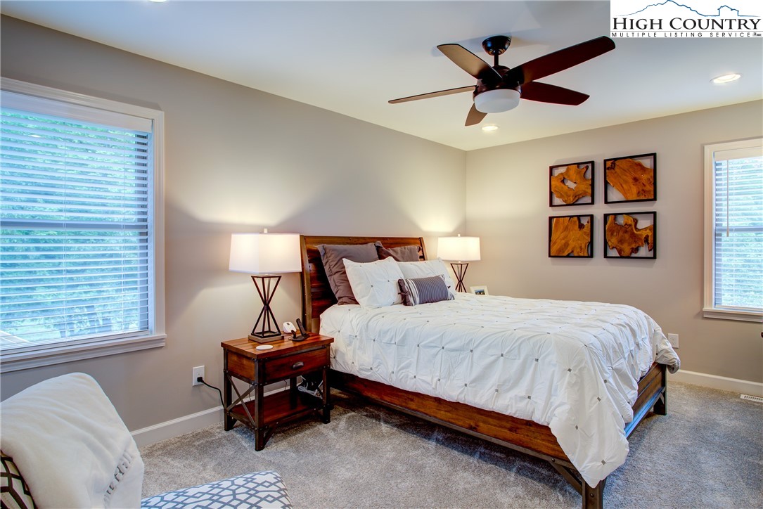142 Casey Overlook Lane, Unit 82 Boone, NC 28607 - Photo 15 of 43 a bedroom with a bed and a window
