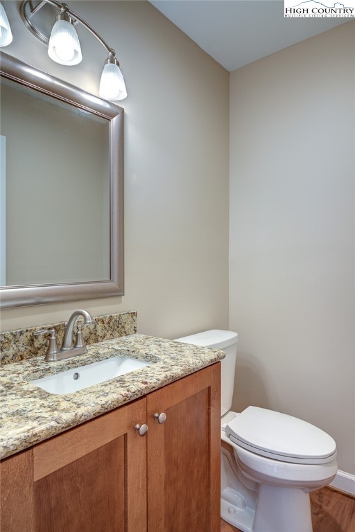 142 Casey Overlook Lane, Unit 82 Boone, NC 28607 - Photo 25 of 43 a bathroom with a granite countertop toilet sink and mirror