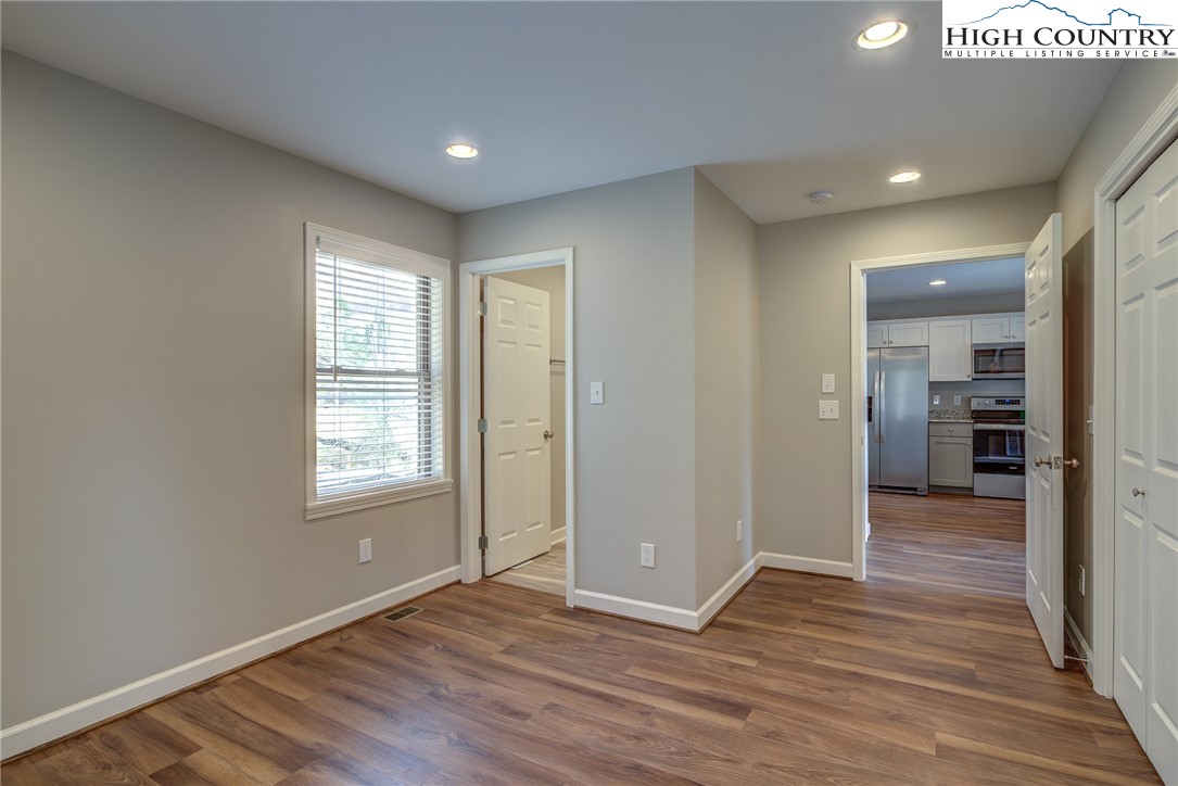 142 Casey Overlook Lane, Unit 82 Boone, NC 28607 - Photo 28 of 43 an empty room with wooden floor and a window
