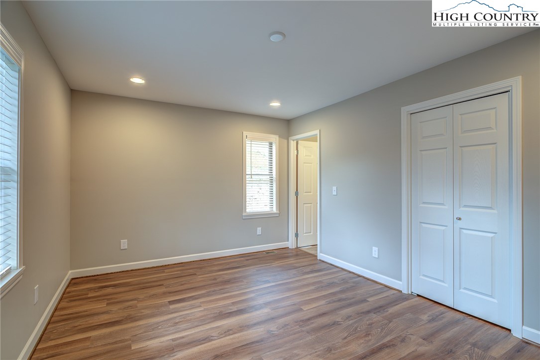 142 Casey Overlook Lane, Unit 82 Boone, NC 28607 - Photo 29 of 43 a view of empty room with wooden floor and fan