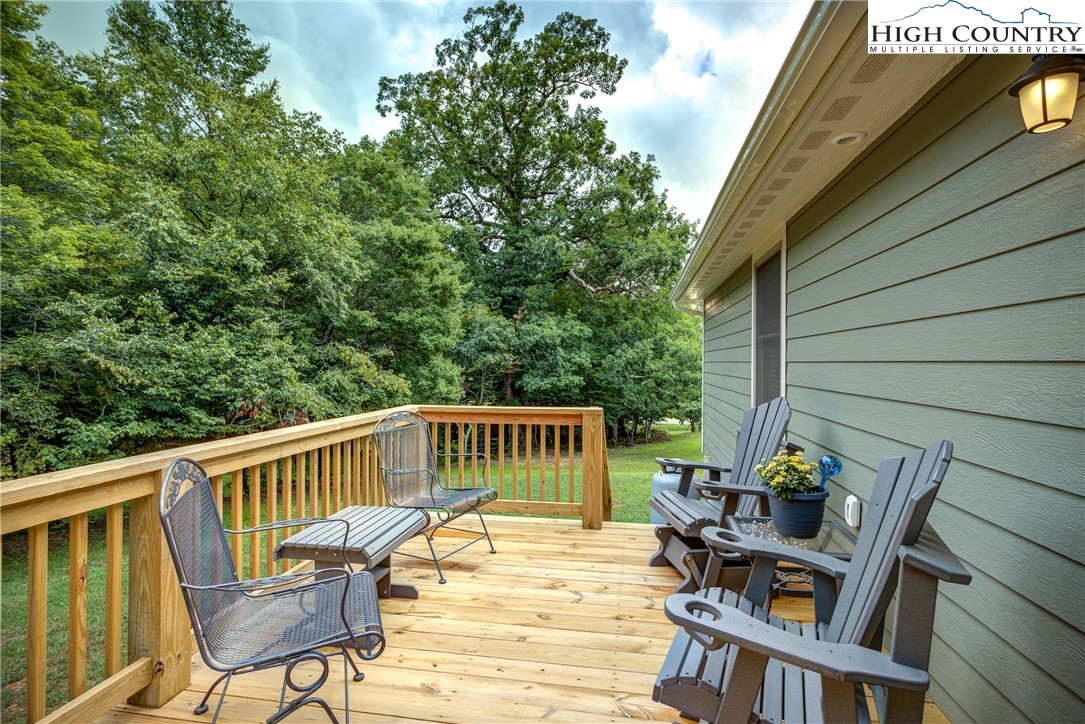 142 Casey Overlook Lane, Unit 82 Boone, NC 28607 - Photo 34 of 43 a view of a deck with chair and wooden floor