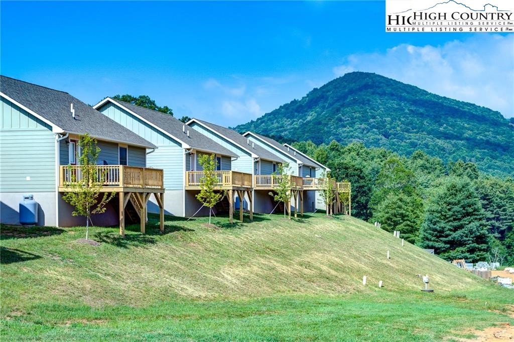142 Casey Overlook Lane, Unit 82 Boone, NC 28607 - Photo 37 of 43 a view of a house with backyard