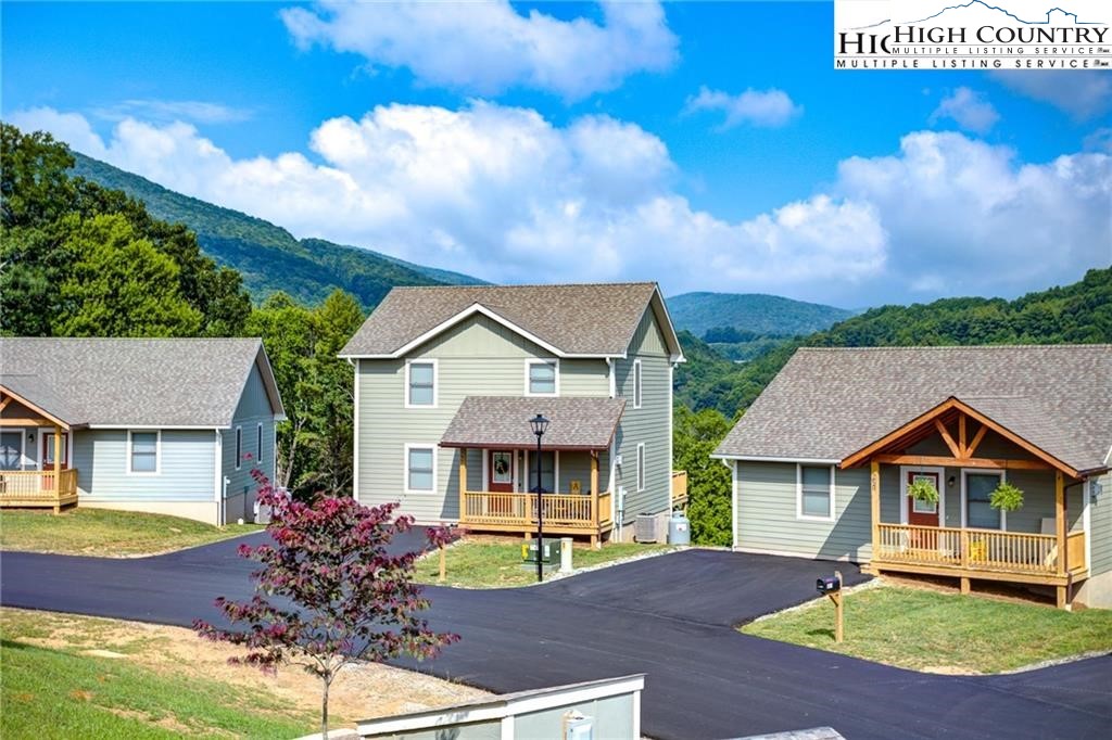 142 Casey Overlook Lane, Unit 82 Boone, NC 28607 - Photo 38 of 43 a front view of a house with garden