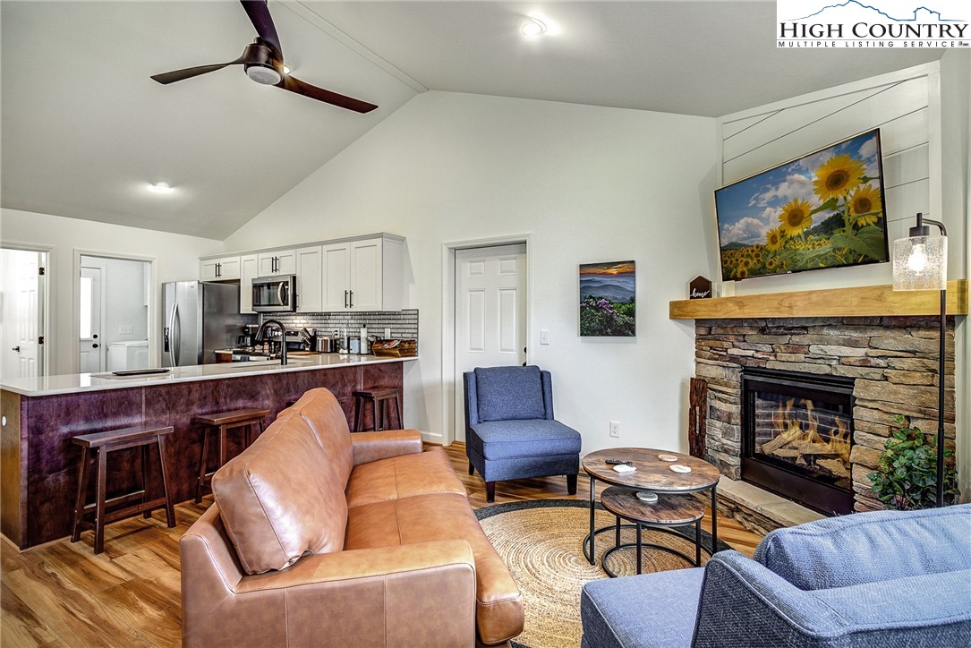 142 Casey Overlook Lane, Unit 82 Boone, NC 28607 - Photo 4 of 43 a living room with furniture a flat screen tv and a fireplace