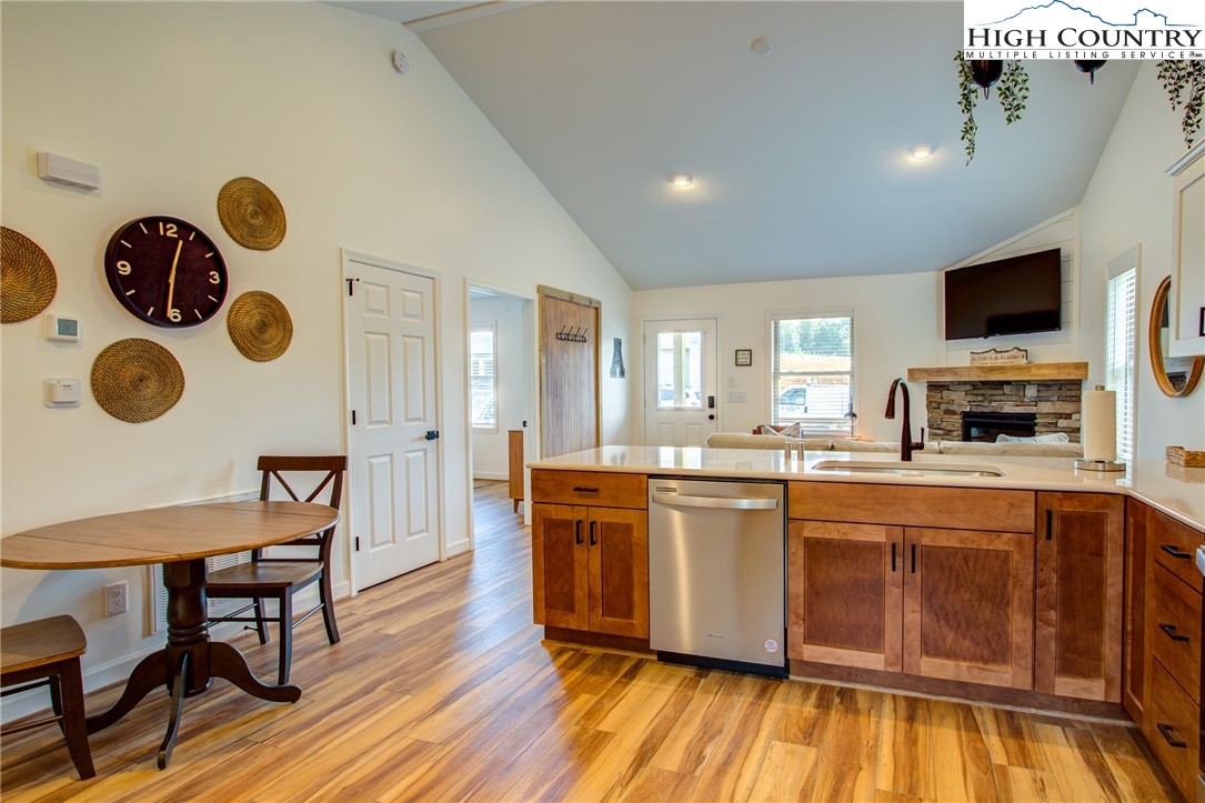 142 Casey Overlook Lane, Unit 82 Boone, NC 28607 - Photo 10 of 43 a large kitchen with stainless steel appliances granite countertop a stove and a wooden floors