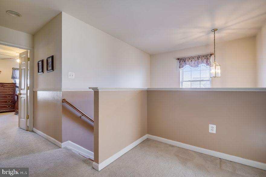 8220 Selwin Court Rosedale, MD 21237 - Photo 19 of 36 Hall area at the top of the stairs