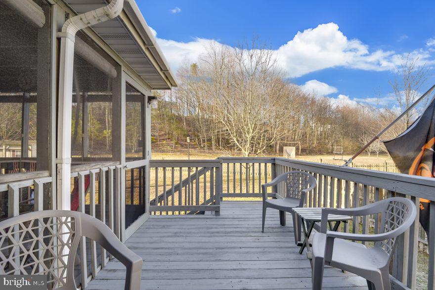 8220 Selwin Court Rosedale, MD 21237 - Photo 32 of 36 Large deck just off screened in porch.