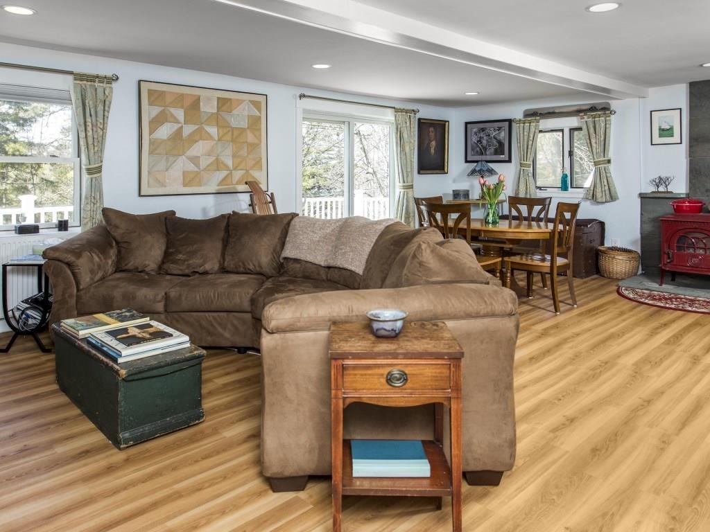 496 Cross Point Road Edgecomb, ME 04556 - Photo 11 of 26 The living room, with woodstove and...