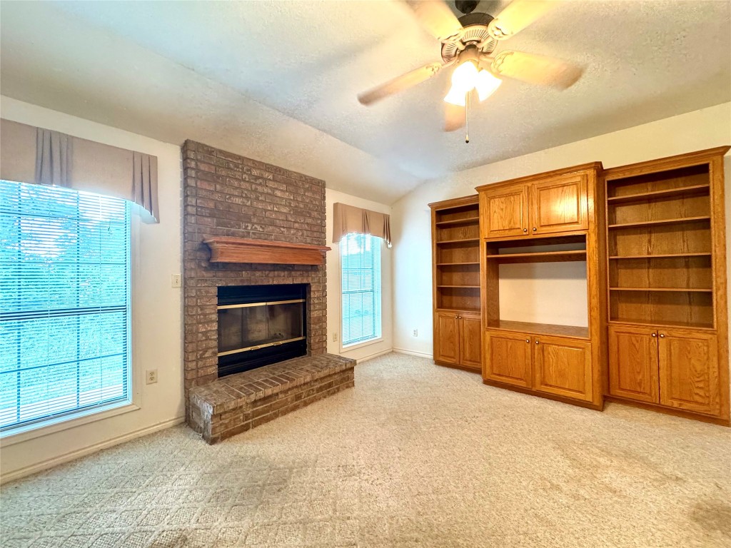 20 Shallow Springs Trinity, TX 75862 - Photo 19 of 48 a view of an empty room with a fireplace and a window