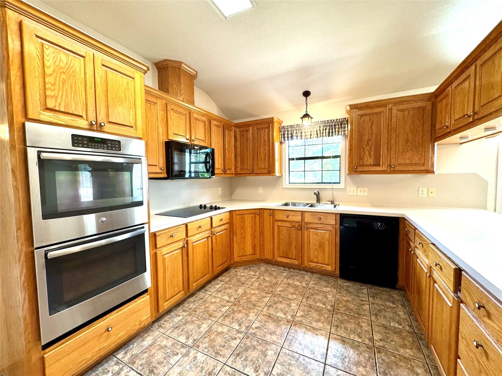 20 Shallow Springs Trinity, TX 75862 - Photo 25 of 48 a kitchen with stainless steel appliances and cabinets