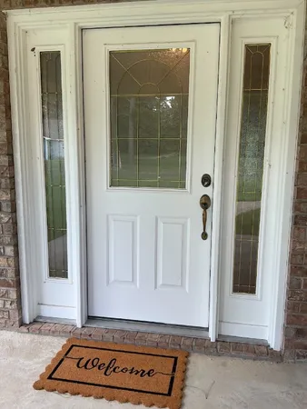 a view of a door and a window