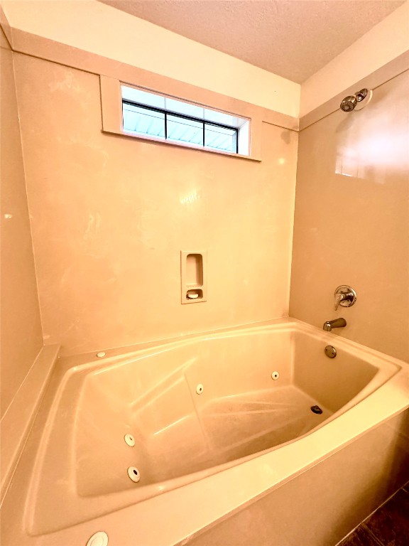 20 Shallow Springs Trinity, TX 75862 - Photo 37 of 48 a bathroom with a bathtub and a shower