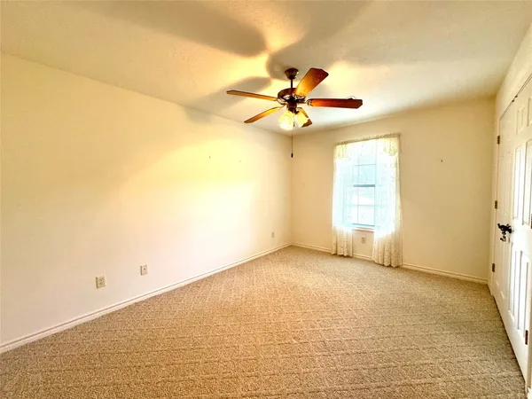 a view of a bathroom with a sink and a mirror