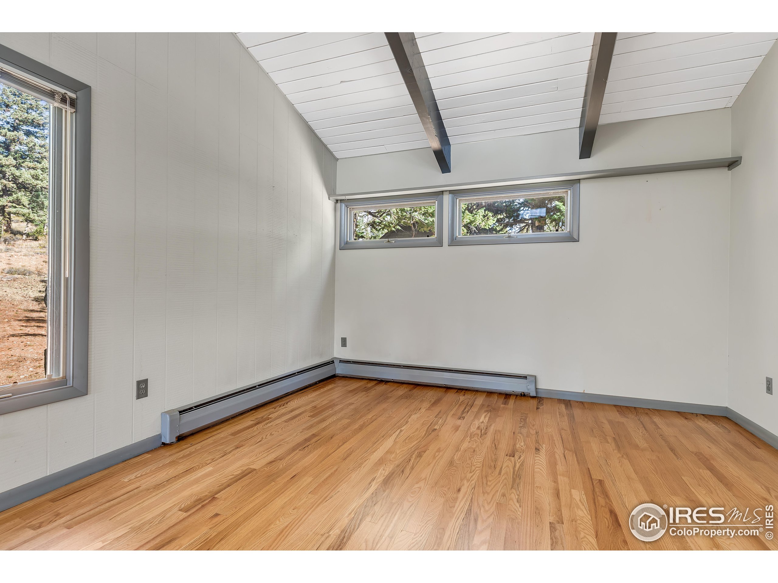 5566 Sugarloaf Road Boulder, CO 80302 - Photo 14 of 35 a view of a room with wooden floor
