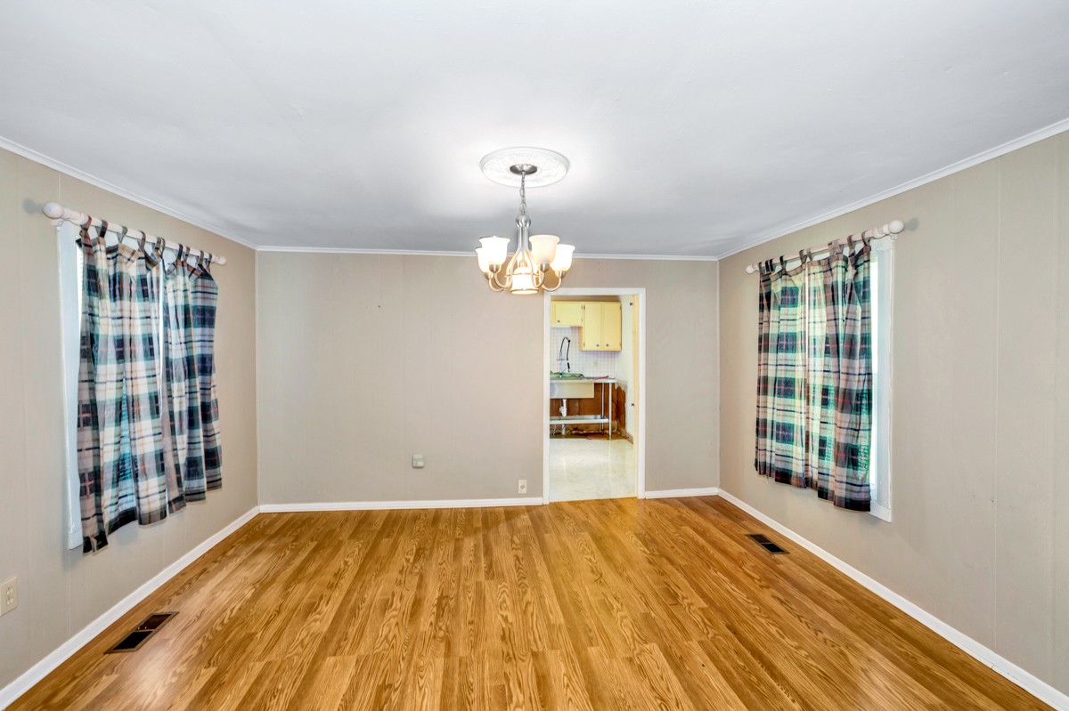 33448 Ardmore Ridge Road Ardmore, TN 38449 - Photo 11 of 19 a view of an empty room with wooden floor and a window