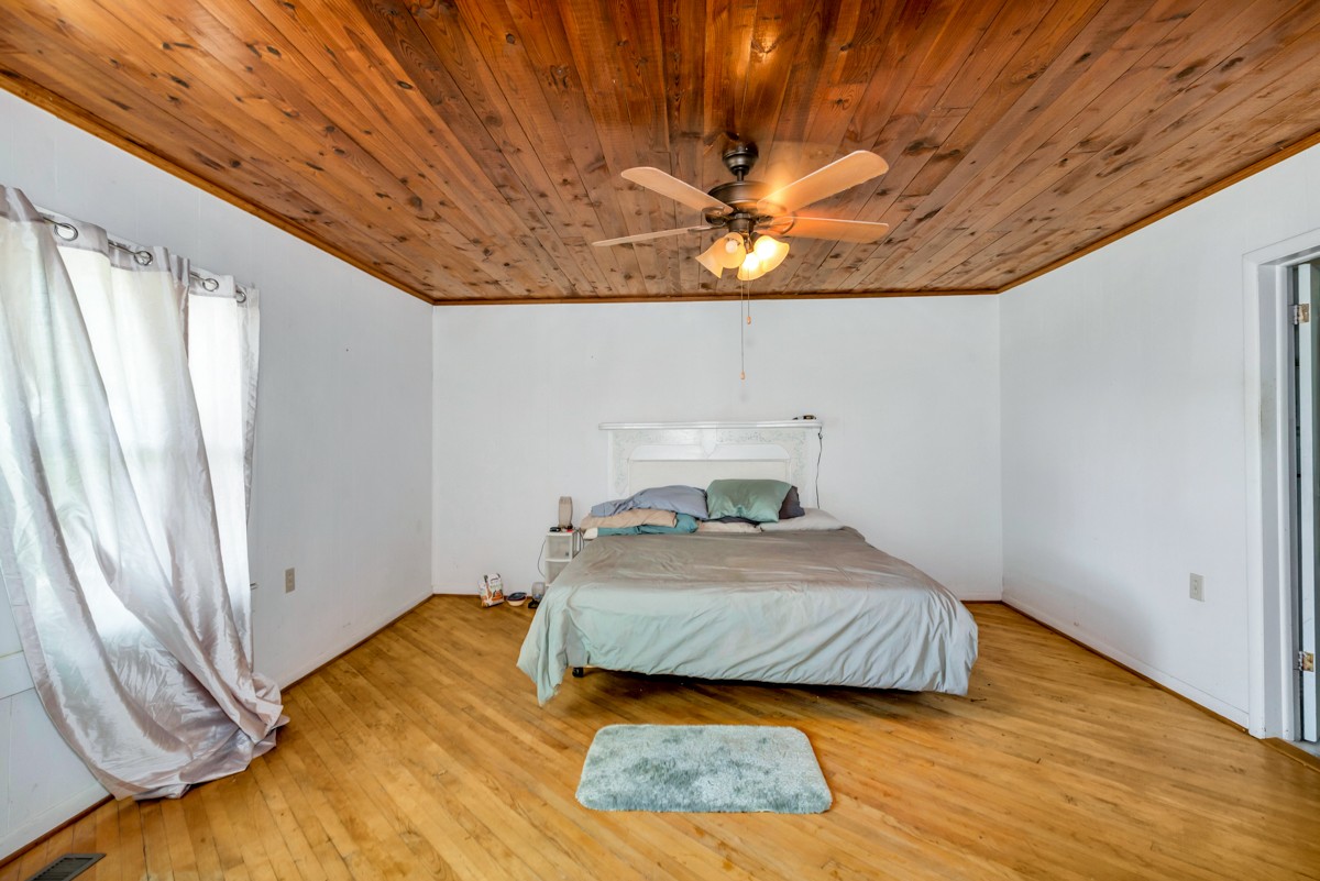 33448 Ardmore Ridge Road Ardmore, TN 38449 - Photo 18 of 19 a bedroom with a bed and a window