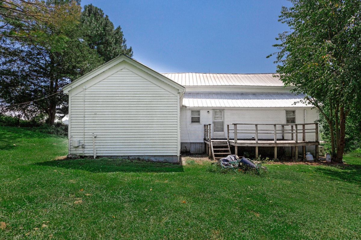 33448 Ardmore Ridge Road Ardmore, TN 38449 - Photo 6 of 19 a view of a house with a backyard
