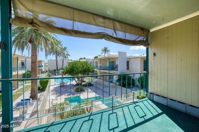 a view of a garden with a bench in patio