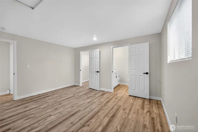 a bathroom with a sink toilet and a mirror