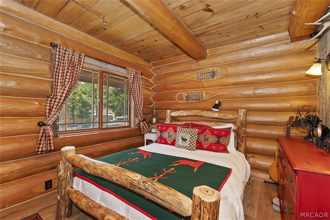 29632 Hook Creek Road Cedar Glen, CA 92321 - Photo 15 of 43 a bedroom with a bed and a window