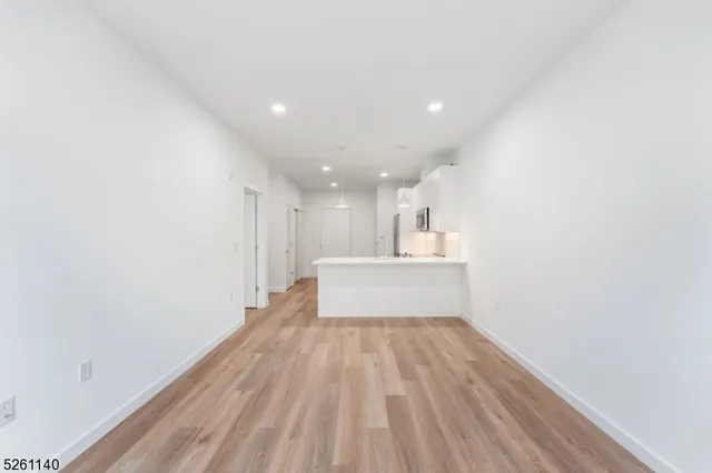 a living room with furniture and windows