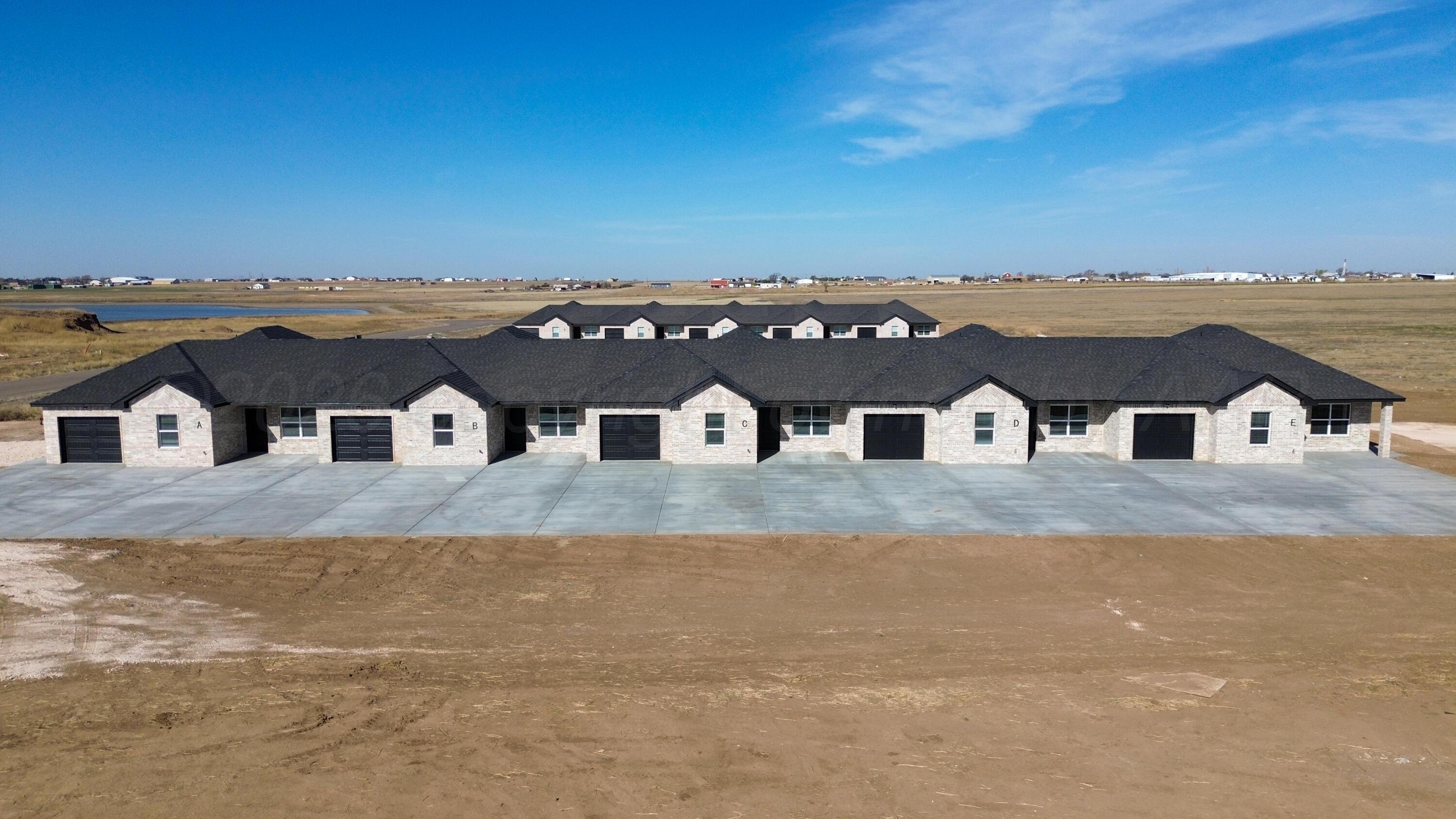 11074 Verano Drive Amarillo, TX 79119 - Photo 2 of 15 an aerial view of residential houses with outdoor space and ocean view