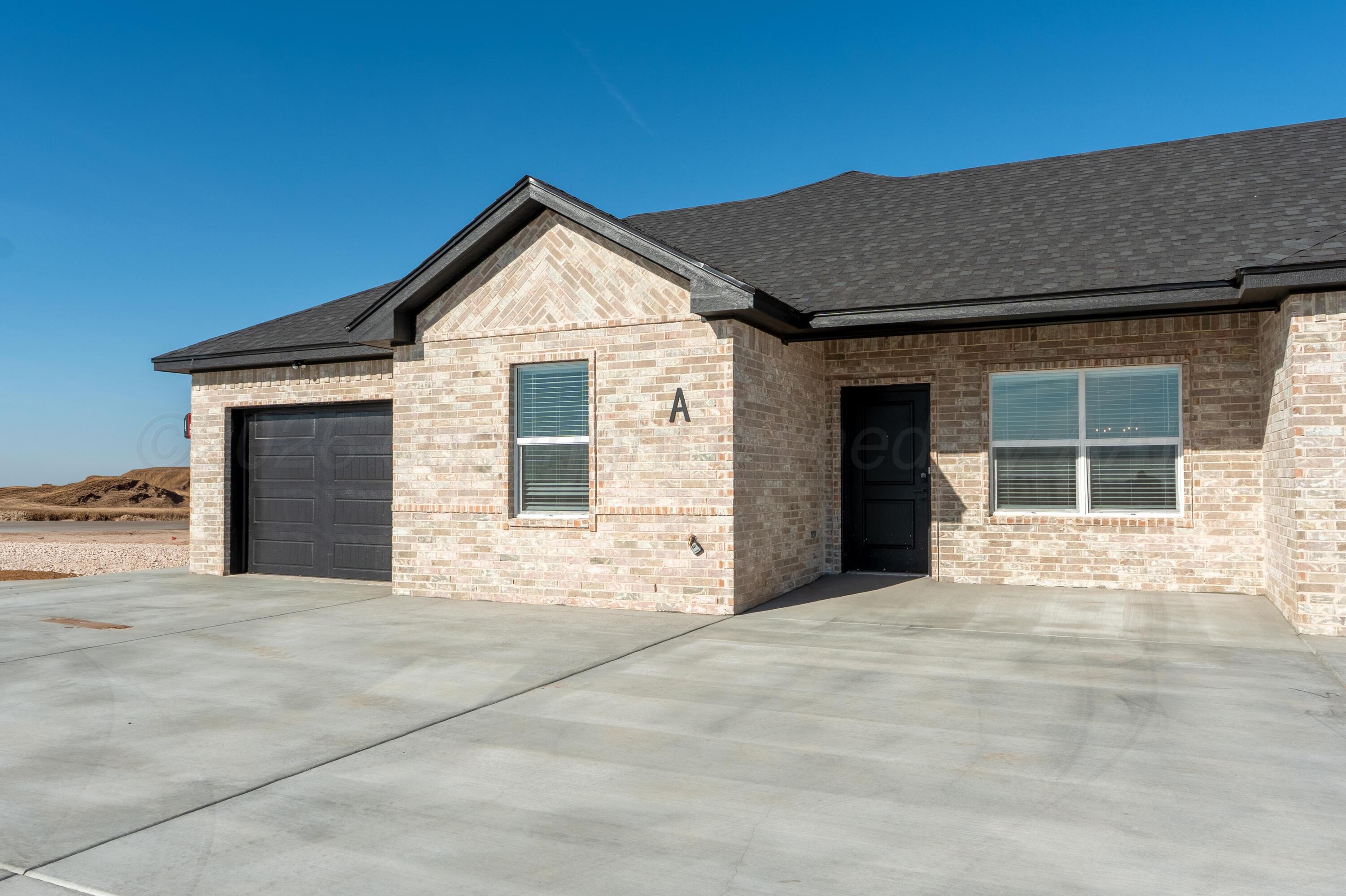 11074 Verano Drive Amarillo, TX 79119 - Photo 4 of 15 a view of a house with a garage