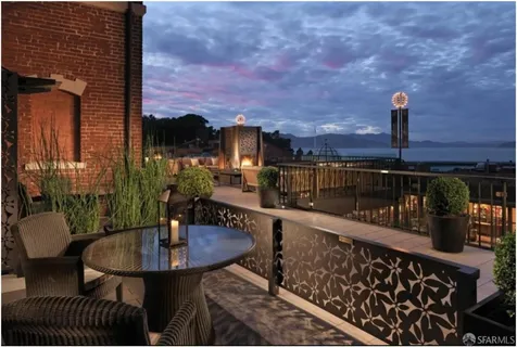 a view of a balcony with chairs