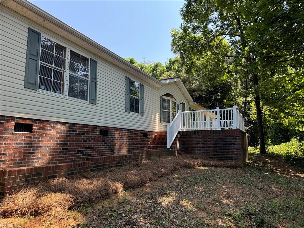 178 Waddell Street Ronda, NC 28670 - Photo 1 of 47 Home is turned around but has beautiful porches & decks on 3 sides!