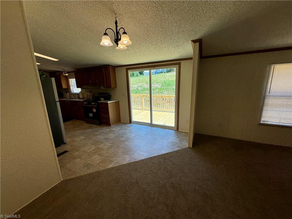 178 Waddell Street Ronda, NC 28670 - Photo 16 of 47 Eat in kitchen space by sliding doors