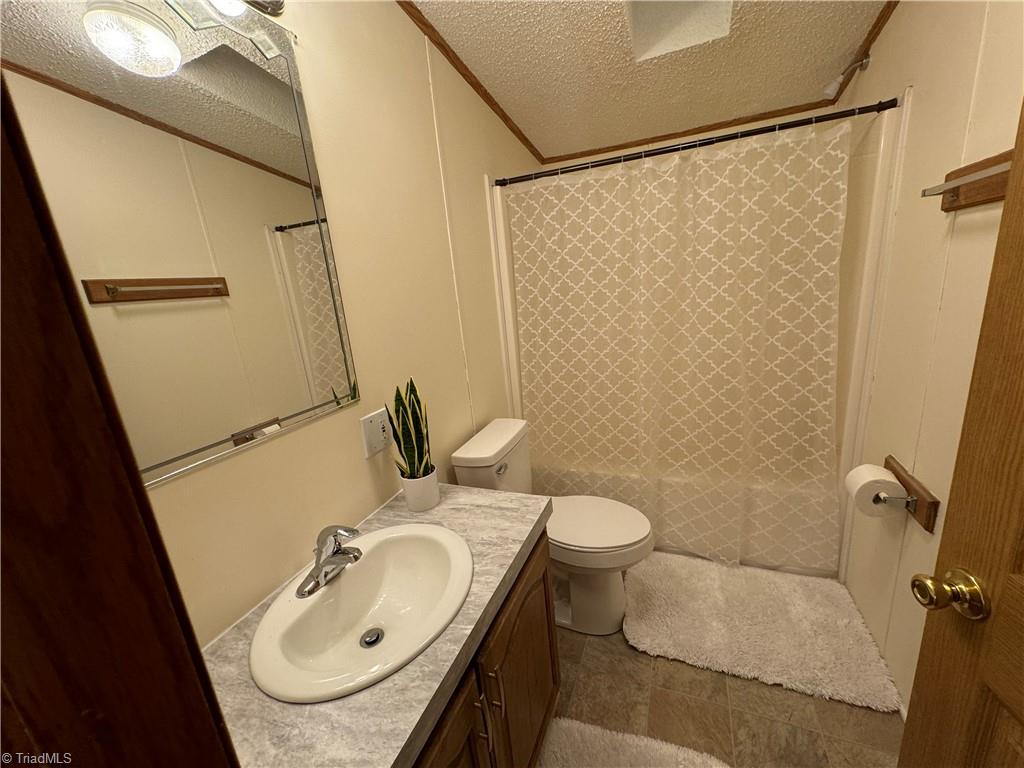 178 Waddell Street Ronda, NC 28670 - Photo 30 of 47 Hall bathroom between bedrooms 2 & 3