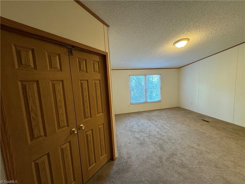 178 Waddell Street Ronda, NC 28670 - Photo 36 of 47 Double doors to bonus room just off huge primary suite
