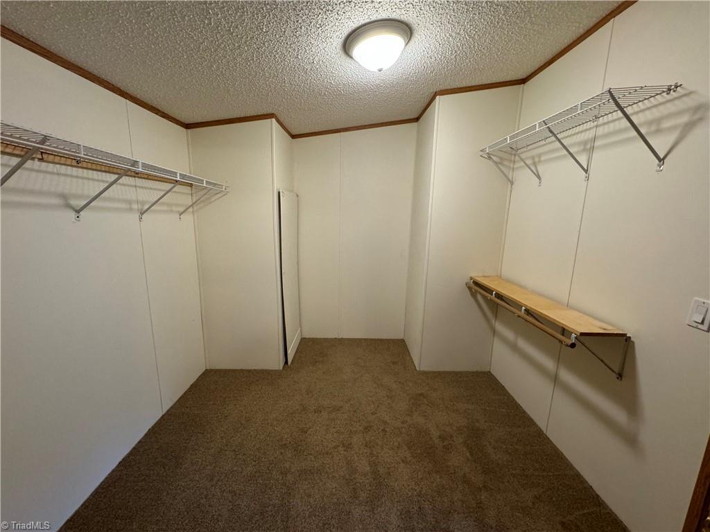 178 Waddell Street Ronda, NC 28670 - Photo 37 of 47 Walk in closet from primary bedroom or from hallway