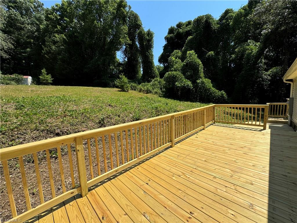 178 Waddell Street Ronda, NC 28670 - Photo 43 of 47 Brand new back porch off the kitchen with sliding glass doors to exit