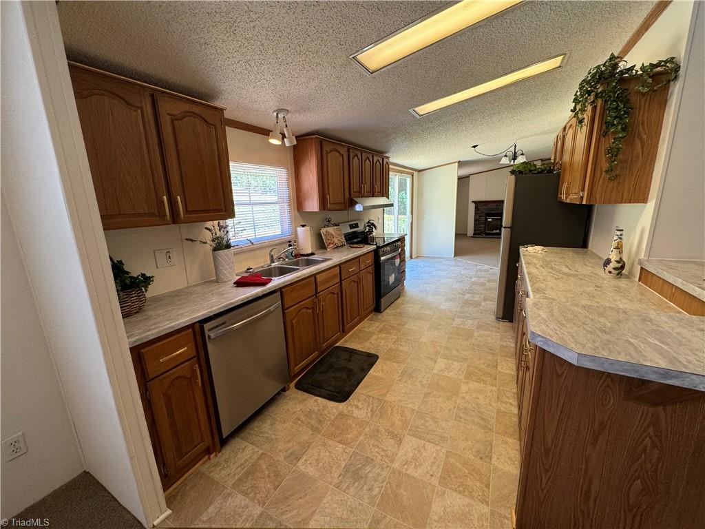 178 Waddell Street Ronda, NC 28670 - Photo 10 of 47 New countertops, vinyl flooring & appliances that remain