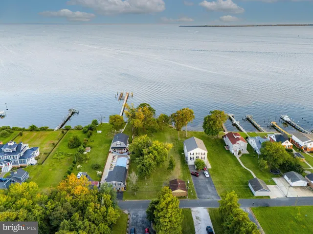 an aerial view of residential house with an outdoor space