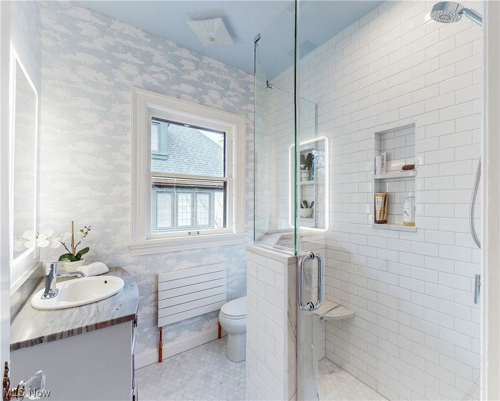 2854 East Overlook Road Cleveland, OH 44118 - Photo 22 of 35 Bathroom with toilet, an enclosed shower, tile flooring, and vanity with extensive cabinet space