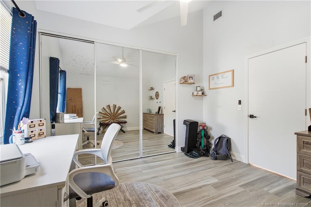 3584 Southwest Sunset Trace Circle Palm City, FL 34990 - Photo 17 of 32 a view of a dining room with furniture and wooden floor