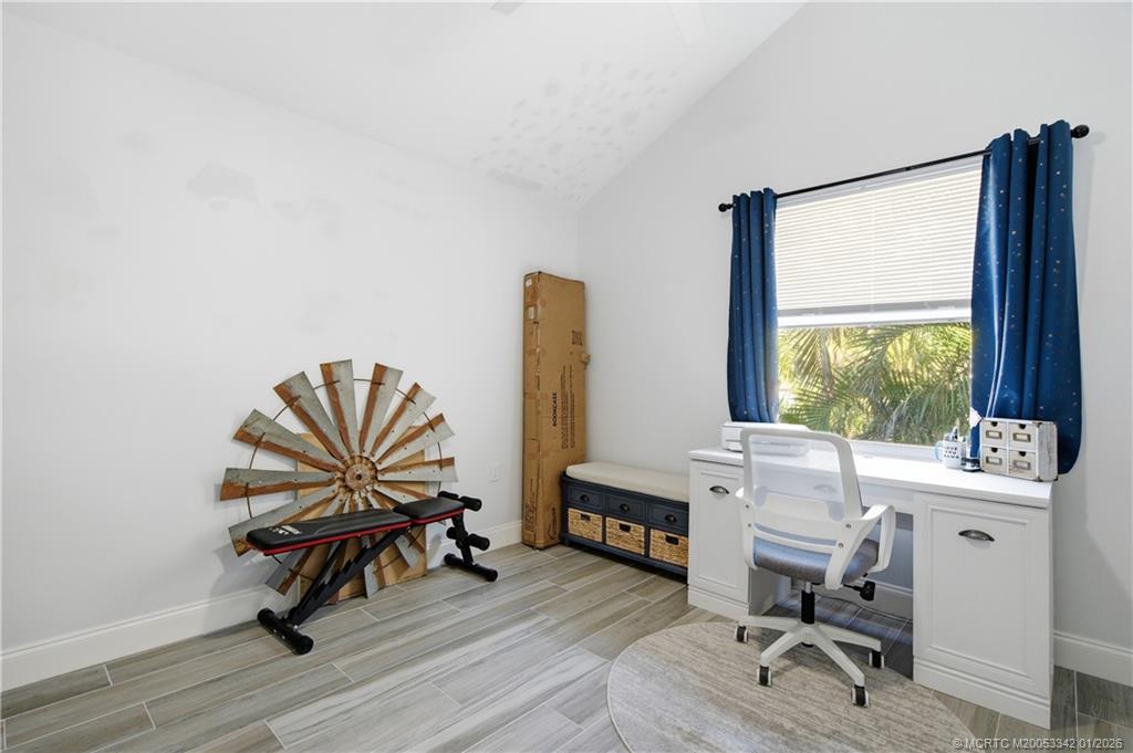 3584 Southwest Sunset Trace Circle Palm City, FL 34990 - Photo 18 of 32 a work room with furniture and a window