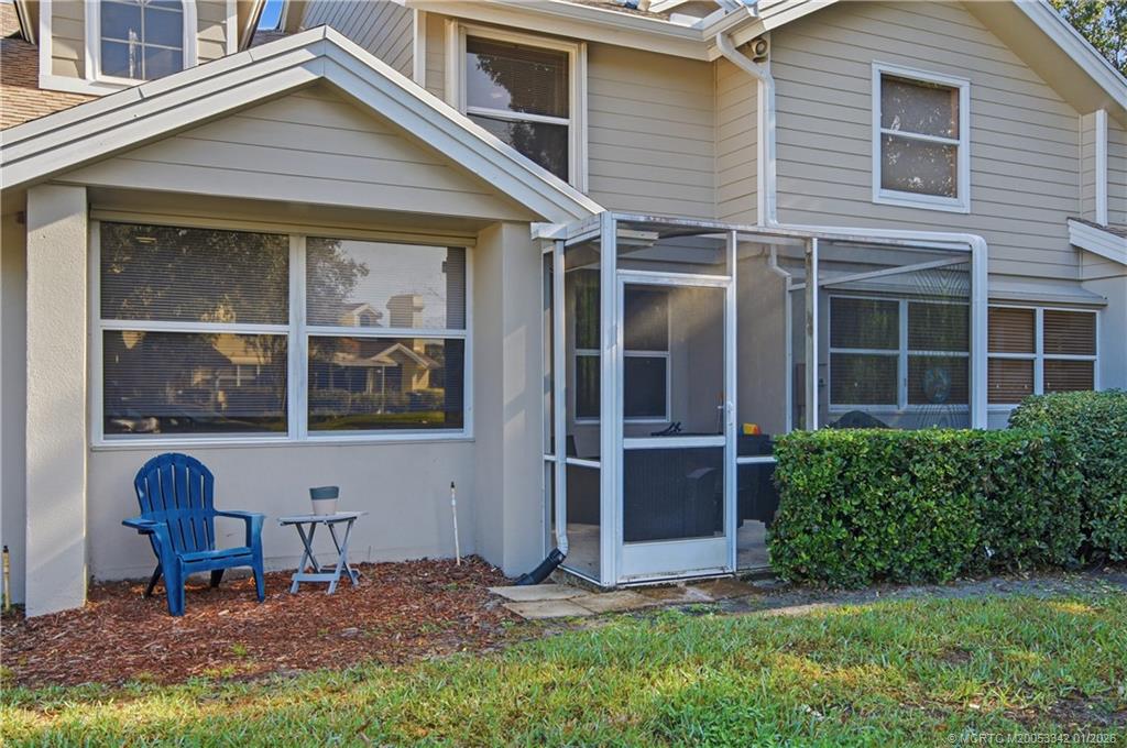 3584 Southwest Sunset Trace Circle Palm City, FL 34990 - Photo 26 of 32 a front view of a house with garden