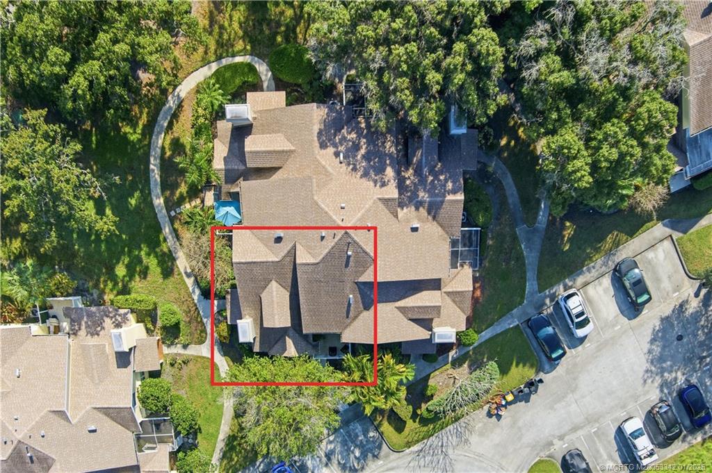 3584 Southwest Sunset Trace Circle Palm City, FL 34990 - Photo 28 of 32 an aerial view of a house with outdoor space and street view